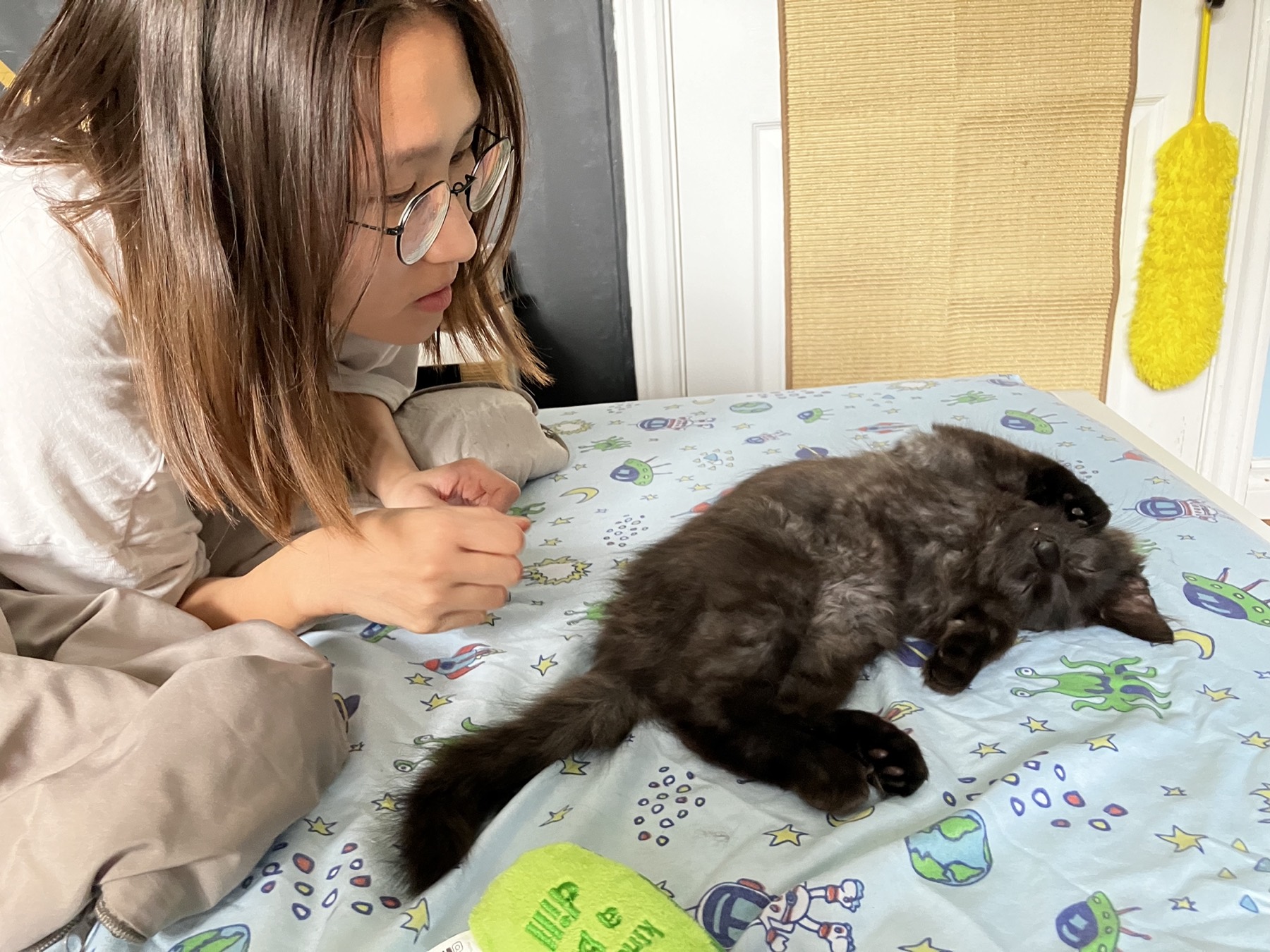 Nike and her human sharing a slow afternoon on the bed